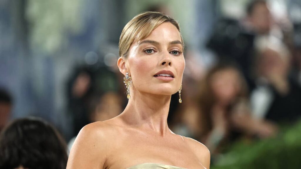 margot robbie officially takes tom ackerley’s surname in the uk